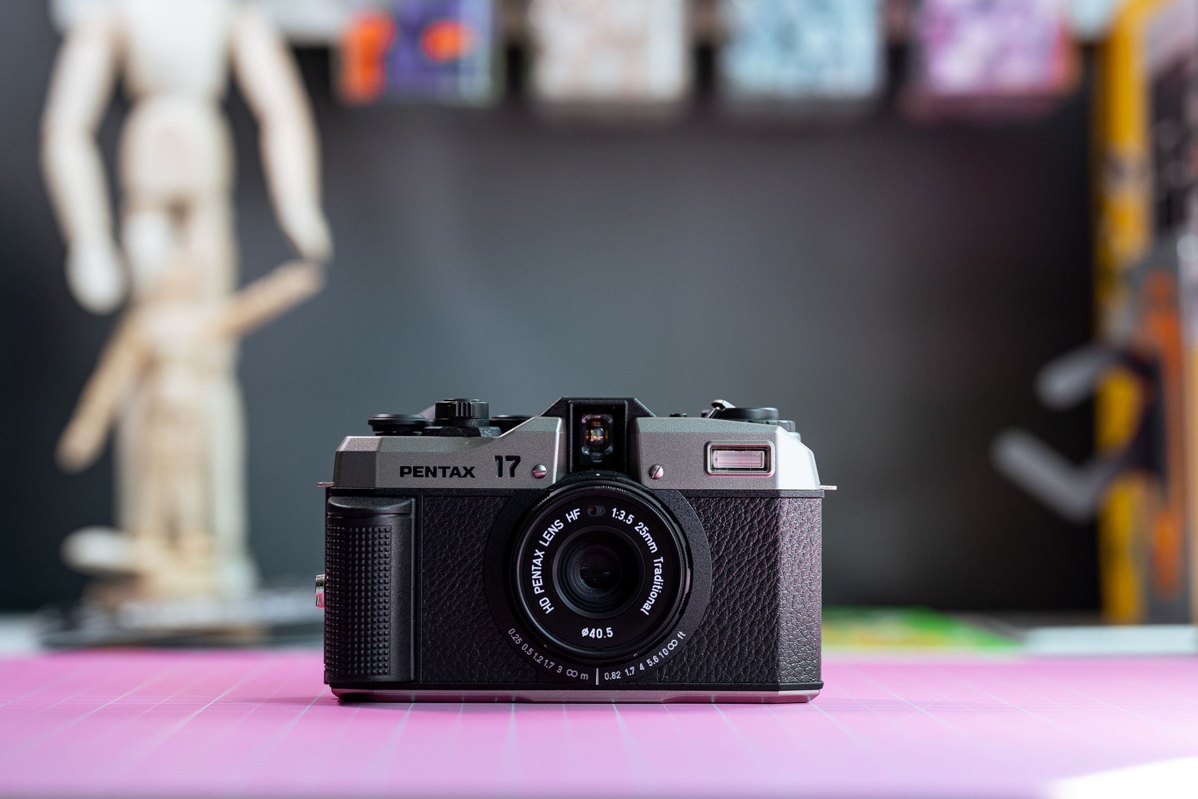 The Pentax 17 camera on a desk.