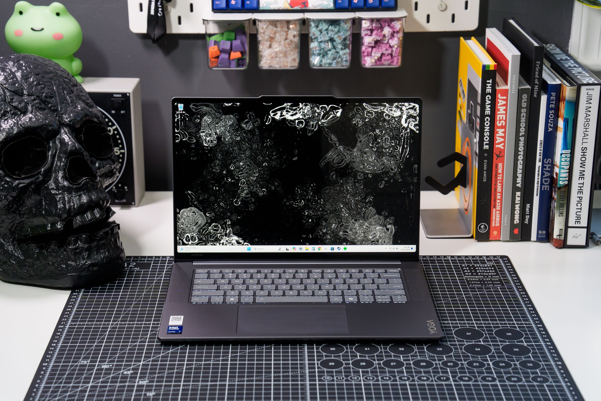 The 15-inch Lenovo Yoga Slim 7i Aura Edition laptop on a workbench.