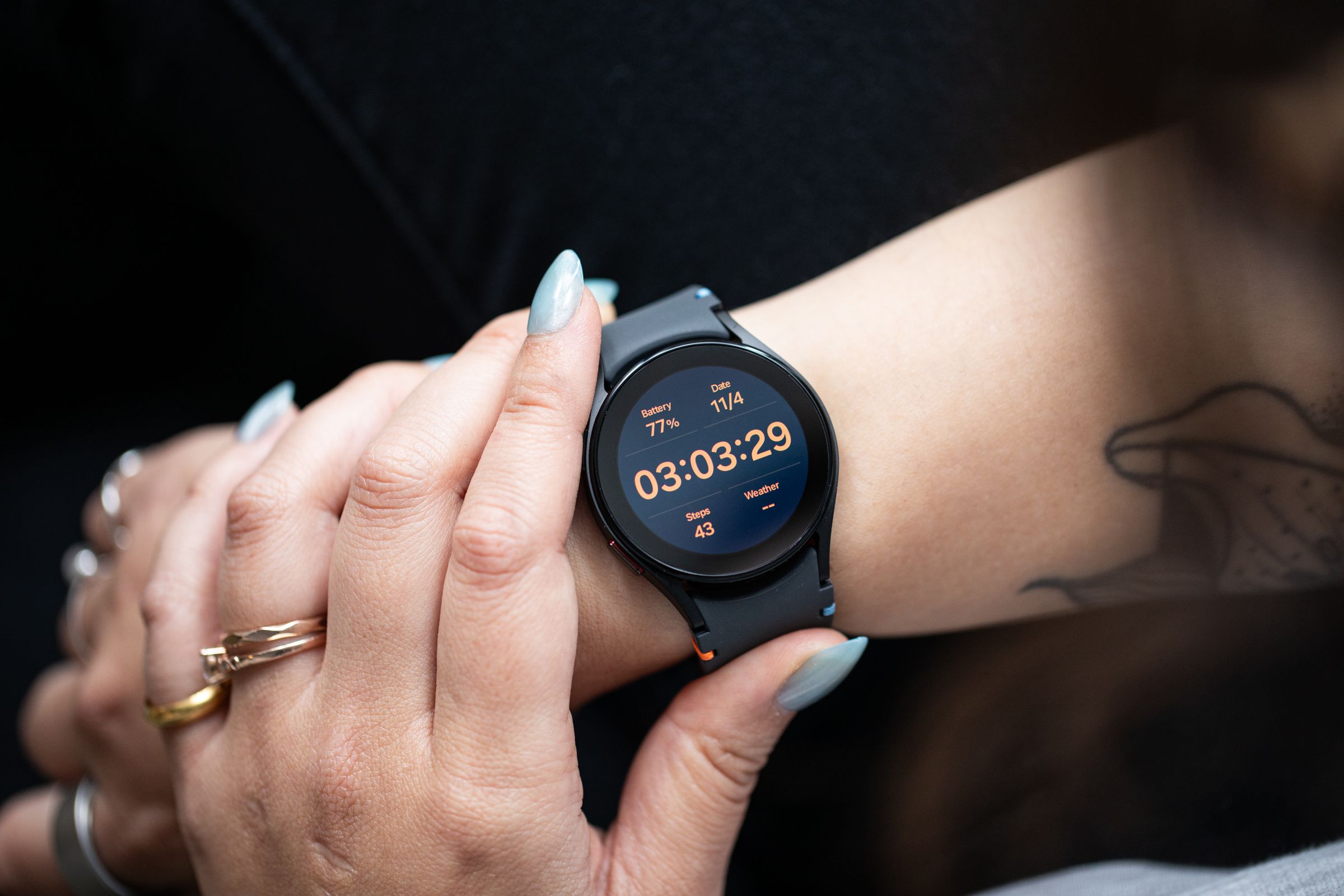 Close-up of the Galaxy Watch FE on a person’s wrist.