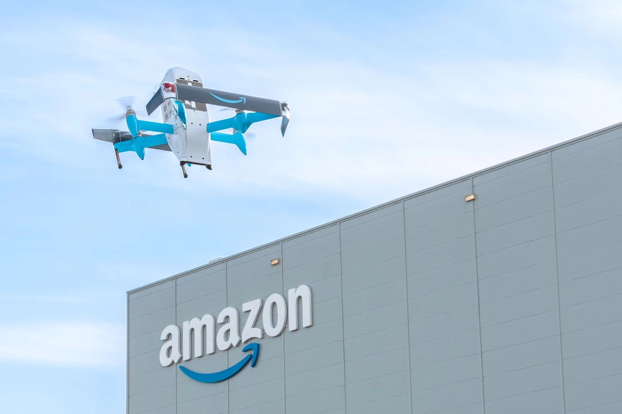 drone in sky with amazon building in background