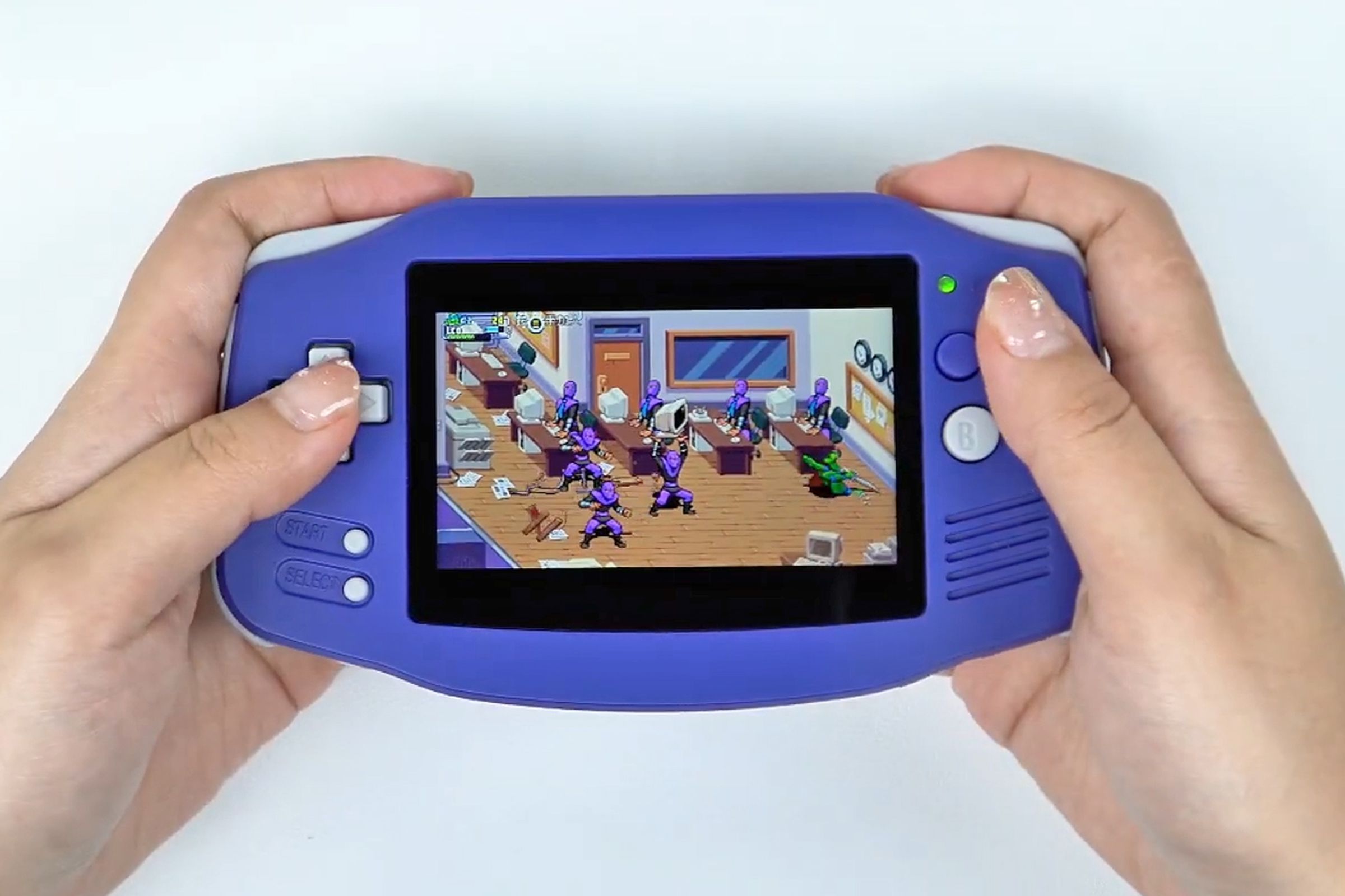 A person is playing a Teenage Mutant Ninja Turtles game on the Anbernic RG34XX retro handheld.