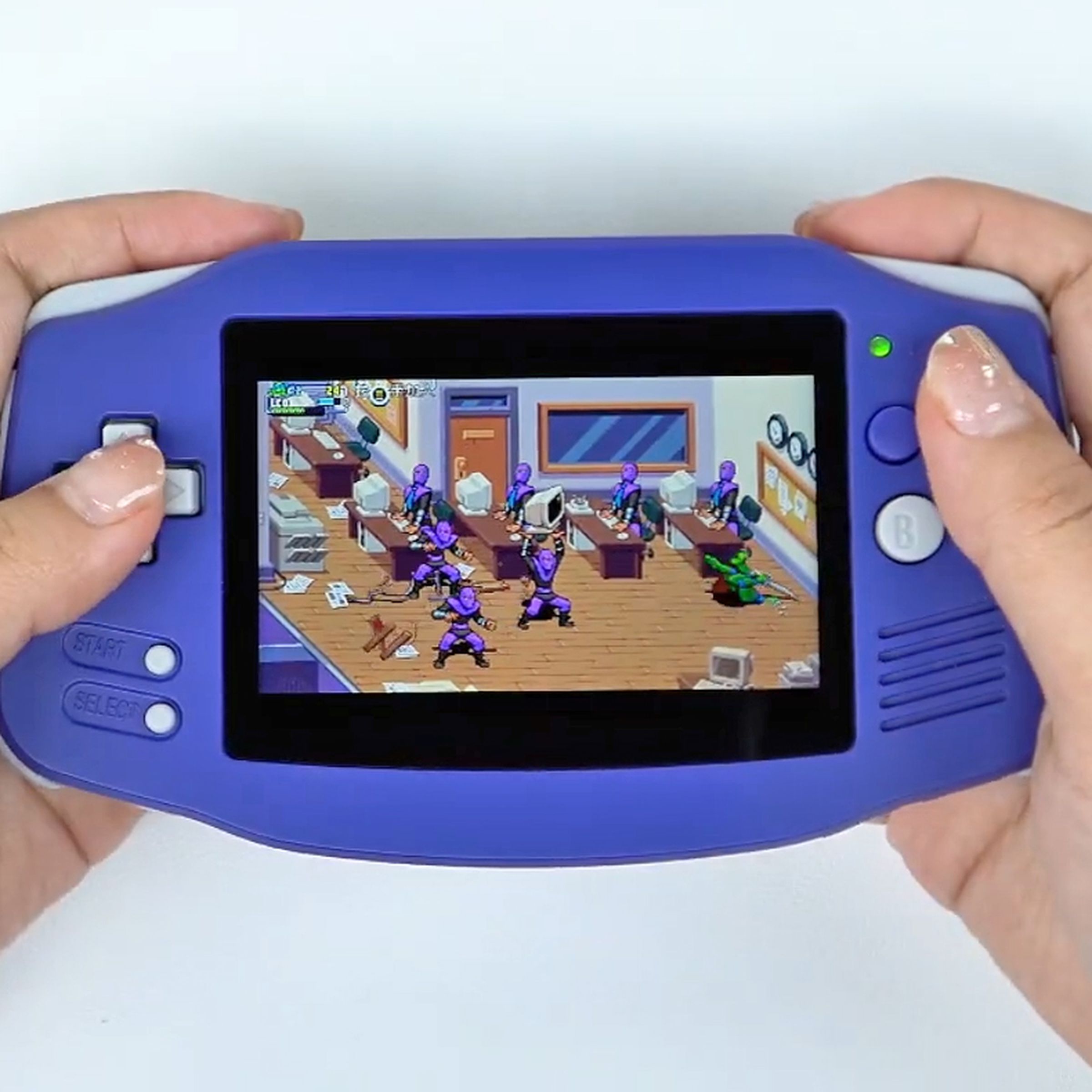 A person is playing a Teenage Mutant Ninja Turtles game on the Anbernic RG34XX retro handheld.