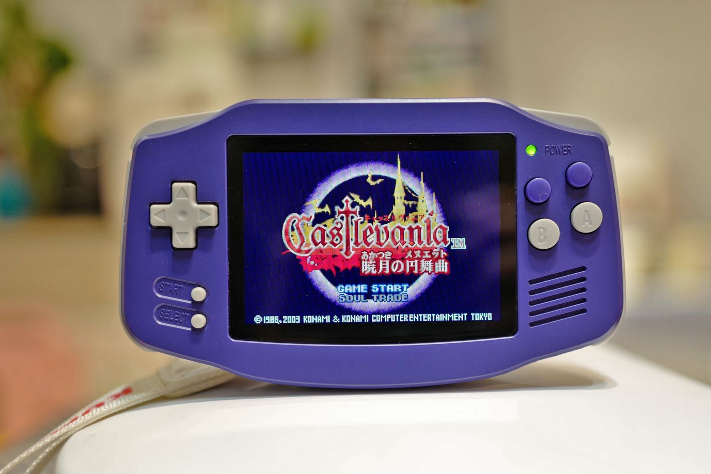 The Anbernic RG34XX shown playing a Castlevania game.