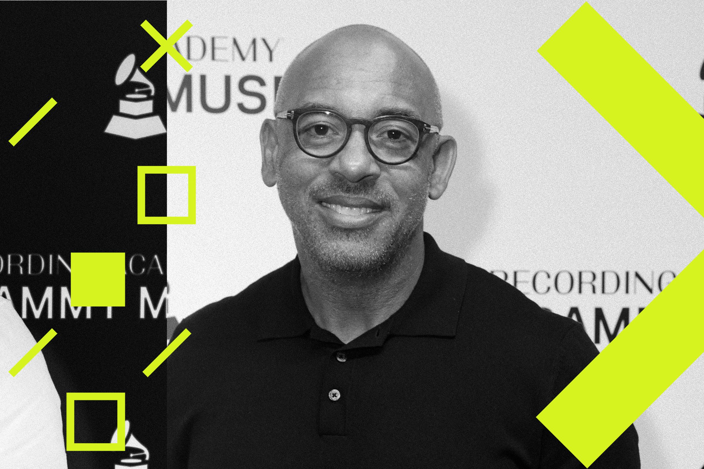 Harvey Mason Jr. smiles at camera at a red carpet event