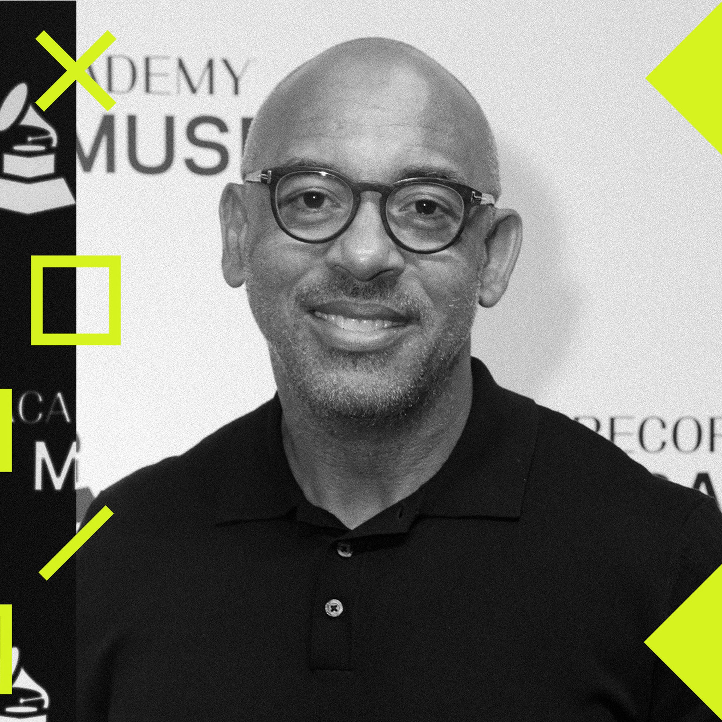 Harvey Mason Jr. smiles at camera at a red carpet event