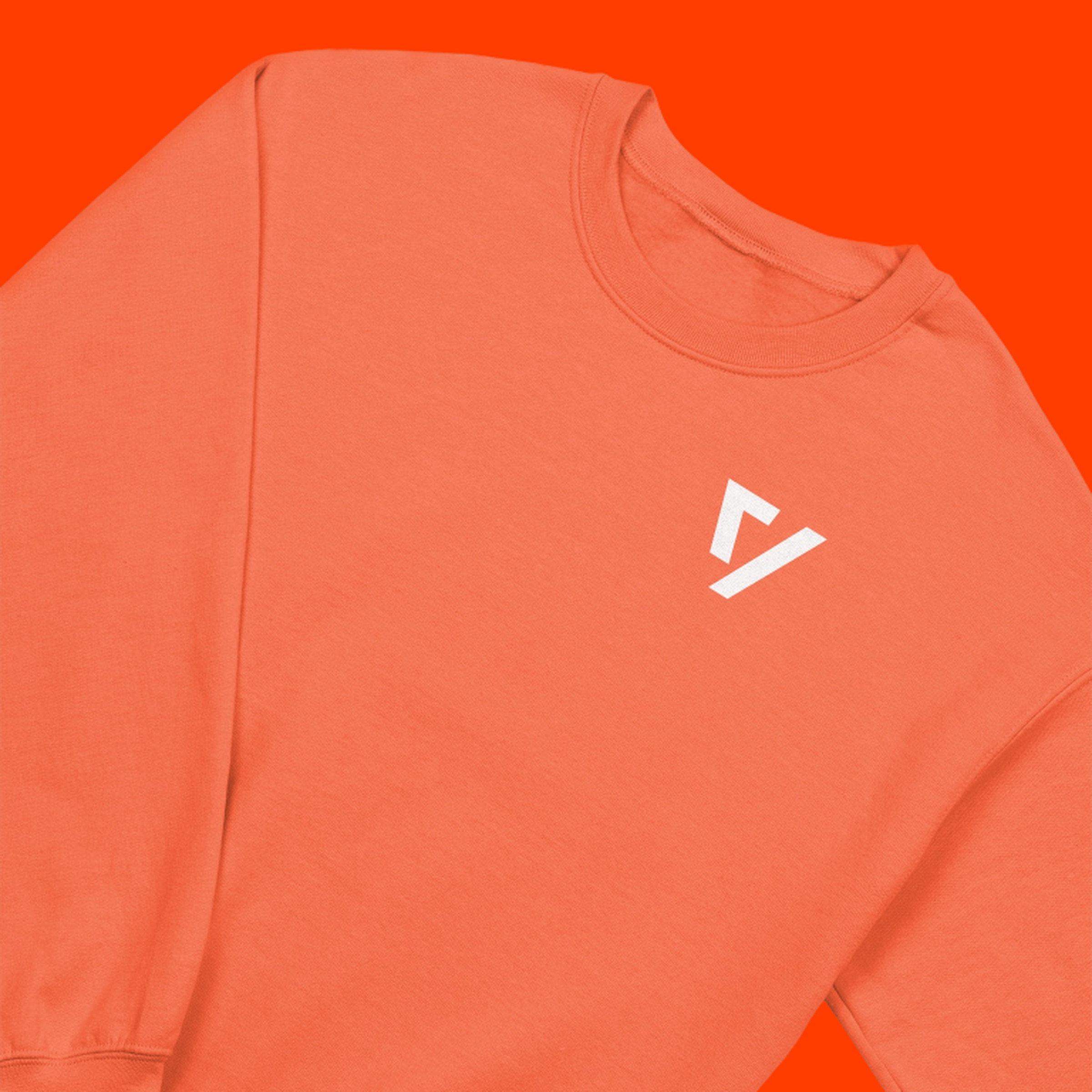 An orange crewneck with The Verge logo on an orange background