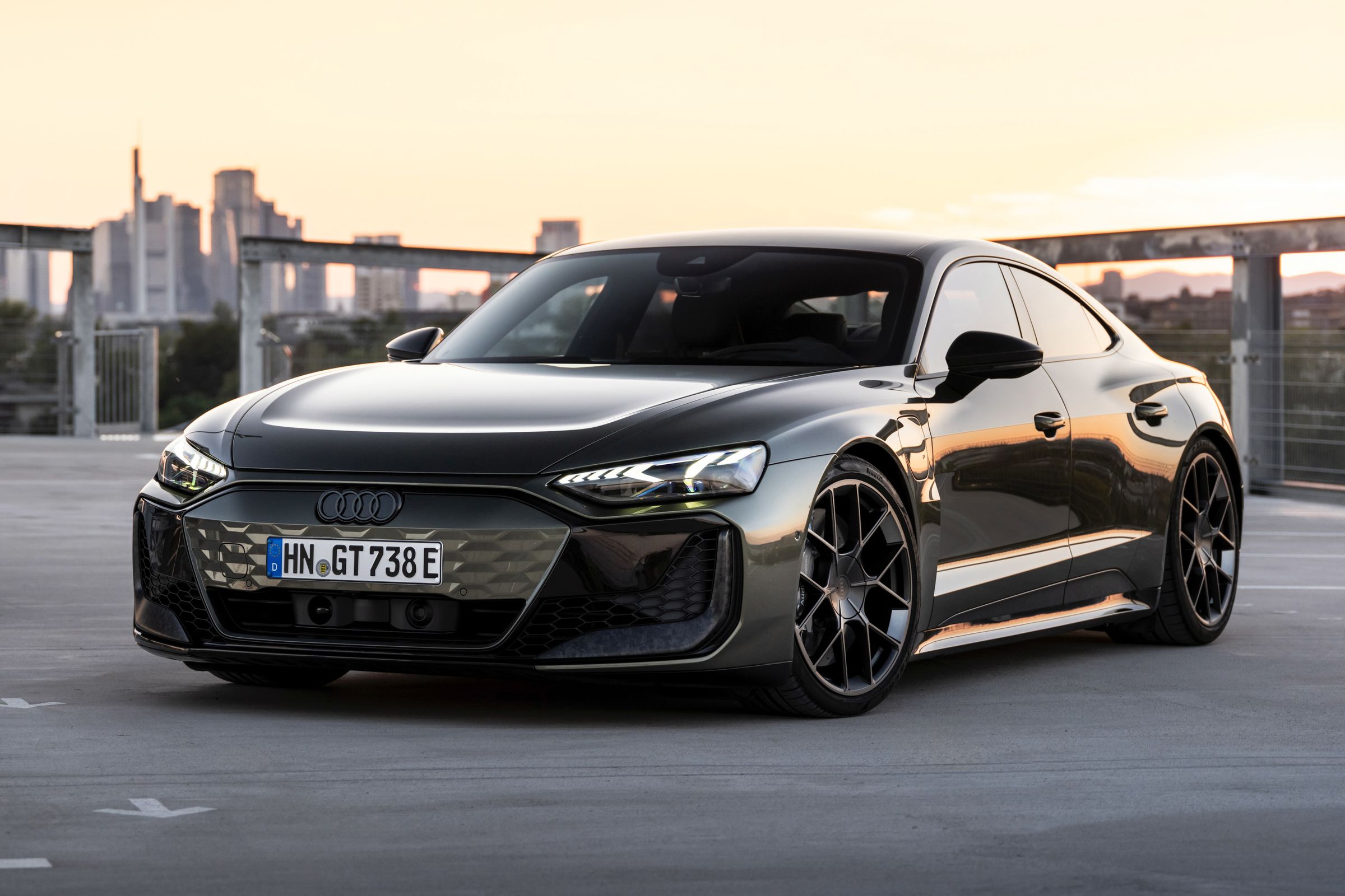 Audi RS GT Performance in black with a sunset city scape in the background