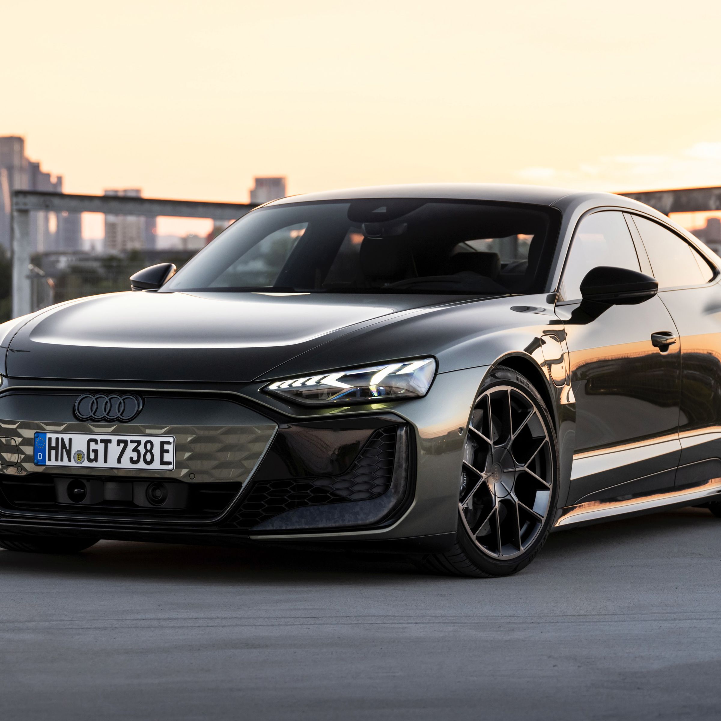 Audi RS GT Performance in black with a sunset city scape in the background